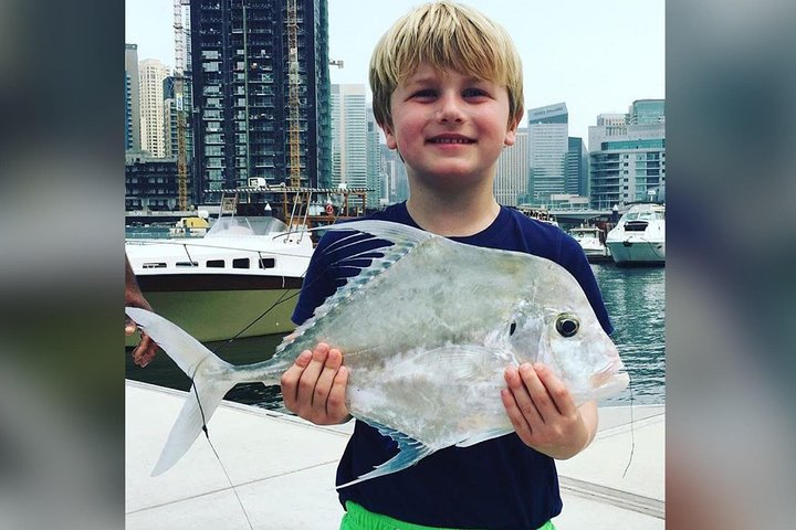 Experience the joy of fishing in Dubai's beautiful waters where families create lasting memories while catching a variety of fish against a stunning skyline backdrop. Perfect for beginners!